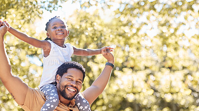 Buy stock photo Happy, playful and fun father and girl in their backyard on a sunny day. Portrait of energetic dad playing and bonding with his child. African family smile and spend time together on the weekend