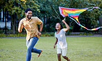 Happy girl and father playing a kite while running in a park, garden or lawn outdoor. Black family bonding, fun and happiness while laugh, smile and joy together with cute and adorable daughter