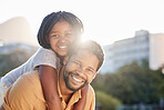 Happy black father carrying girl, child or kid outdoors in nature park outside. Portrait, support and love of caring male parent bonding with daughter with a smile together while taking a walk.