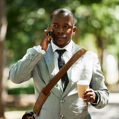 Buy stock photo African businessman in street, has phone call with coffee or tea in cup. Corporate black man has work conversation on cellphone, walking to take break in lunch time in town or city