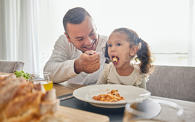 Buy stock photo Father feed lunch food to girl for support with health, child development and growth while relax at home. Eating meal, dad or man feeding kid daughter while happy and enjoy quality time together