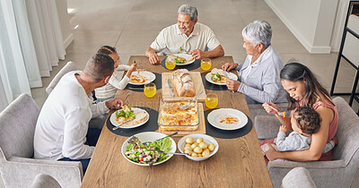 Buy stock photo Family, dinner and people from Mexico eating food at a event, holiday celebration or home meal. Talking, conversation and speaking together at the table with kids, grandparents and parents at a house