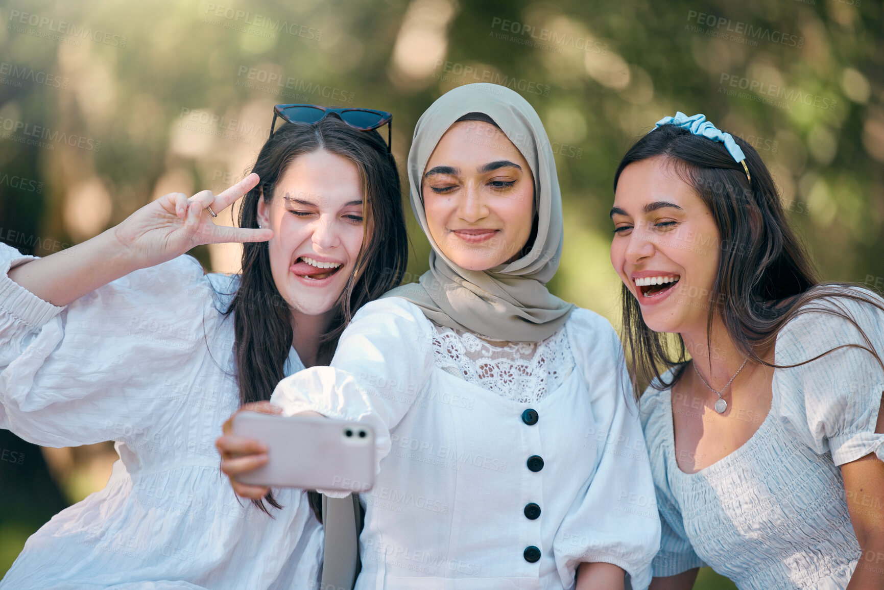 Buy stock photo Selfie, phone and friends in nature park relax, bond or enjoy outdoor quality time together on spring day. Smile, goofy or fun group of people, girl or diversity women post to online social media app