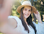 Selfie portrait of woman in nature park relax, happy and smile while in outdoor forest for peace, quiet and freedom. Happiness, trees and calm girl taking picture to post to online social media app