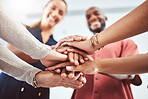 Hand, teamwork and motivation with a business team and their hands in a huddle while standing in a circle in the office together. Collaboration, goal and success with a group of staff in celebration