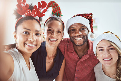 Buy stock photo Friends, family and diversity in a Christmas selfie to celebrate the festive season. Black man, women and a happy smile at office xmas party. Team celebration and taking a holiday photo.