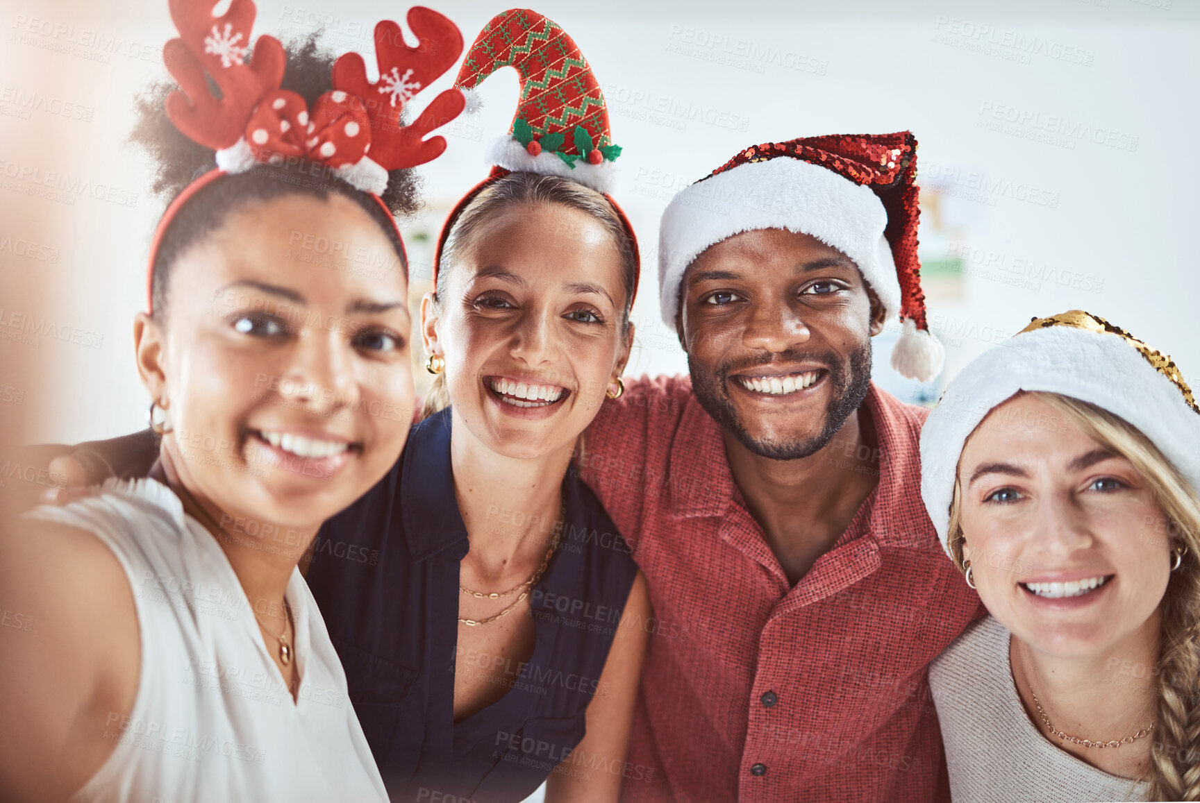 Buy stock photo Friends, family and diversity in a Christmas selfie to celebrate the festive season. Black man, women and a happy smile at office xmas party. Team celebration and taking a holiday photo.