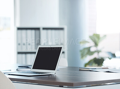 Buy stock photo Empty office space and laptop or screen on a desk of software coding, cybersecurity and technology company or business. Creative SEO, social media and digital notebook at advertising marketing agency