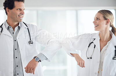 Buy stock photo Elbow greeting, covid or hospital doctors in compliance to stop global virus spread in healthcare or wellness room. Smile, happy or collaboration in man or woman medical teamwork in social distancing