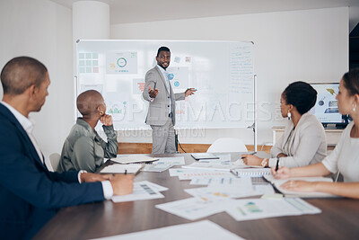 Buy stock photo Business, meeting and businessman speaker talking about company data, graph and analytics. Diversity employee group with corporate manager working on a teamwork strategy presentation in a office
