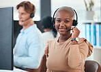 Call center woman, telemarketing and customer service consultant wearing a headset and looking happy at her office desk. Contact us and crm agent offering support and friendly service with a smile