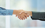 Handshake, partnership and trust in support, teamwork or deal together against a blurred background. Business people shaking hands in agreement, success and help in company greeting or welcome