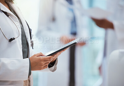 Buy stock photo Doctor, hands and digital tablet checking medical data, tests and research at the hospital against a blurred background. Healthcare GP professional hand at work on touchscreen technology at a clinic