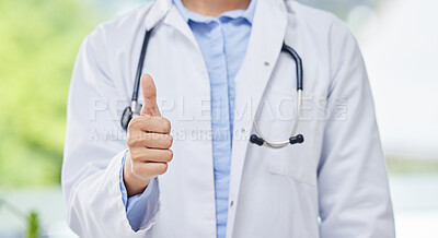 Buy stock photo Doctor, thumbs up and hand of a medical employee, thank you healthcare gesture against blurred background. Hands of a expert surgeon with stethoscope in yes sign or agreement for health success