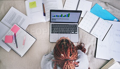 Buy stock photo College education and study laptop on bed with school books and sticky notes in home. University student studying graph, analytics and reading digital learning notes for exam preparation.
