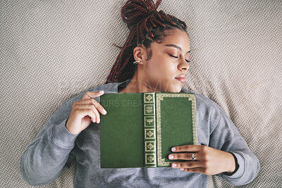 Buy stock photo Tired, sleeping student with book on bed after studying, reading or learning knowledge at home. Burnout gen z or young black woman asleep in bedroom with textbook for university scholarship education