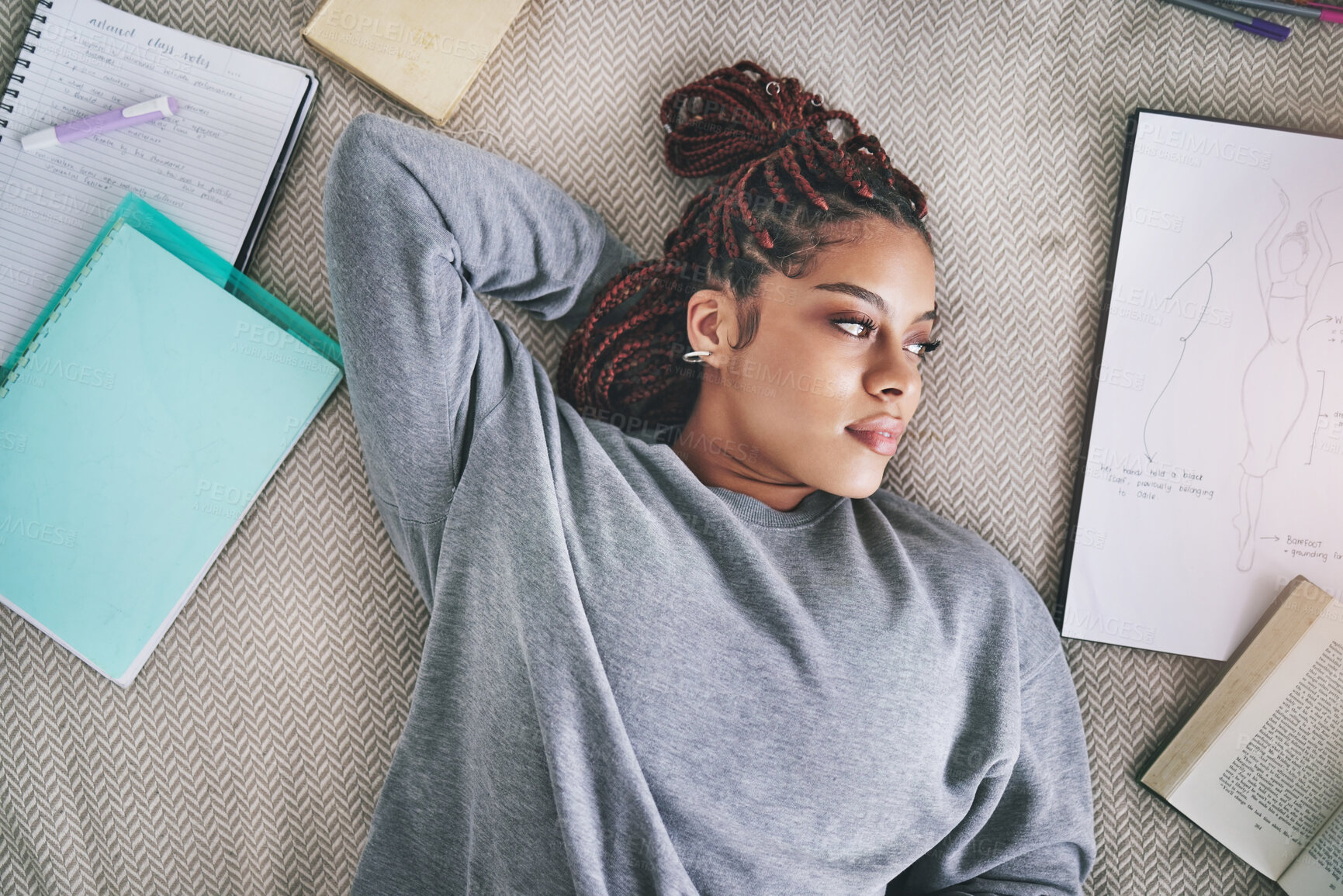 Buy stock photo Design, fashion student and black woman on bed lost in ideas. Relax, thinking and inspiration, thoughtful young designer on break from school work. Creative student with books and drawing in bedroom.