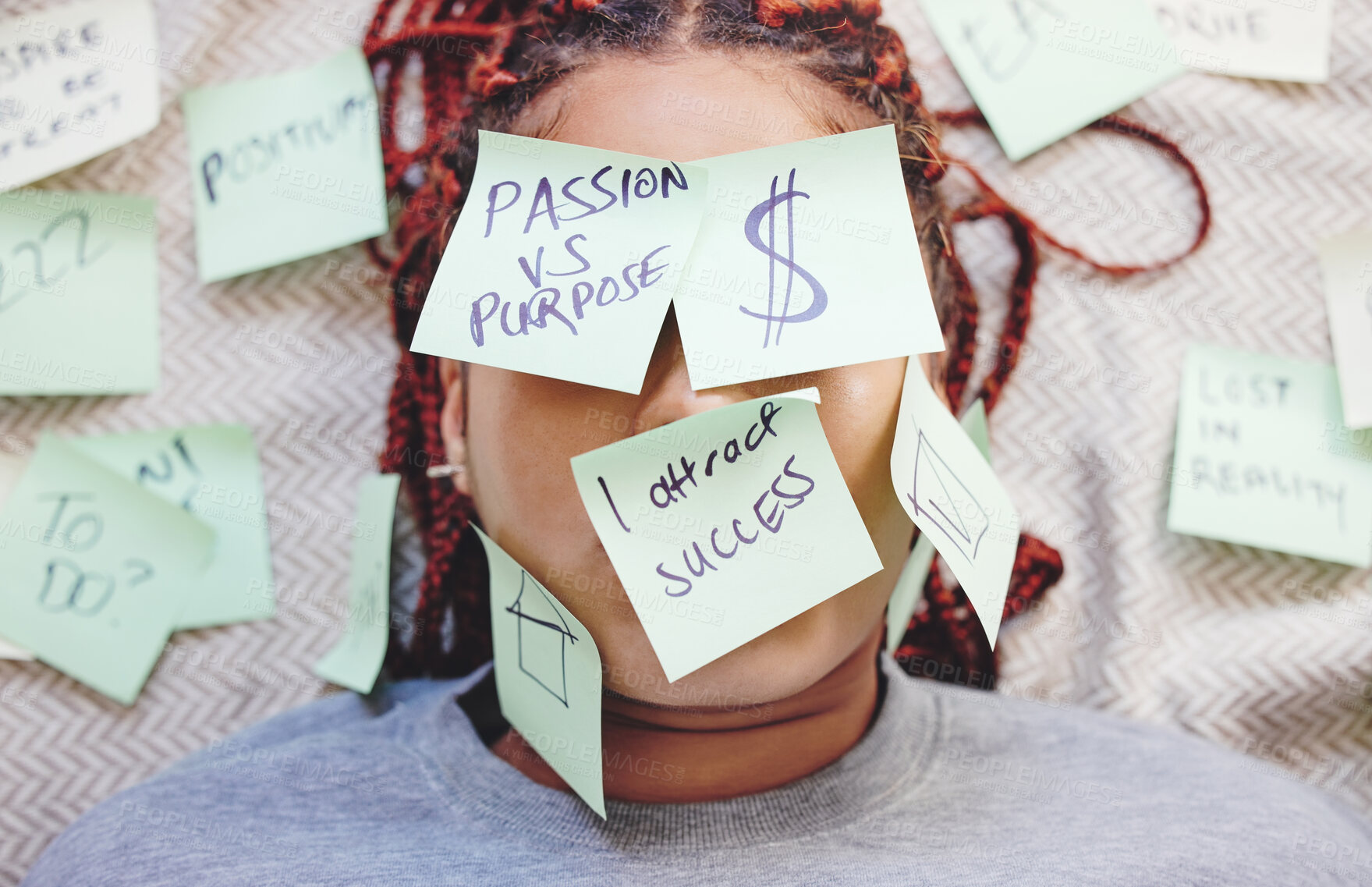 Buy stock photo Black woman tired with sticky note on face, motivation for success and money on bed. African girl in bedroom, stick idea in writing on skin and eyes, for manifestation of dreams of house and wealth