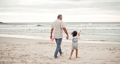 Buy stock photo Family, beach and grandfather holding hands with child and bonding for holiday, support and trust. Summer, vacation and love with grandpa and young girl walking to the sea for break and happiness