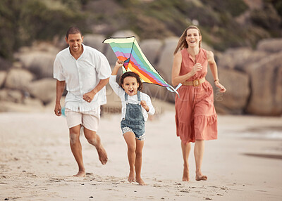Buy stock photo Happy family with child and a kite on the beach in summer for wellness, growth and energy while running together on sand. Love, care and healthy support of mother, father and girl at outdoor holiday