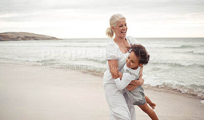 Buy stock photo Beach, fun and grandmother playing with child for holiday, bonding and care together by the ocean. Summer, vacation and happy relationship with young foster girl and grandma embracing by the sea 