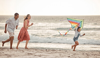 Buy stock photo Happy family, beach vacation and child flying kite while running by the sea with her mother and father. Energy, fun and playing while bonding on holiday and summer travel with man, woman and kid