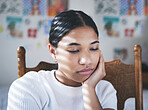 Depression, anxiety and stress by woman thinking and looking sad, sitting and lonely in her bedroom. Young female suffering with mental health problem after a breakup, bad news or suicide thoughts