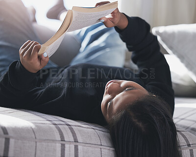 Buy stock photo Bed, book and woman reading, relax in a bedroom on a peaceful morning in her home. Hobby, books and comfort by black female enjoying weekend with literature and interesting novel, rest in her house