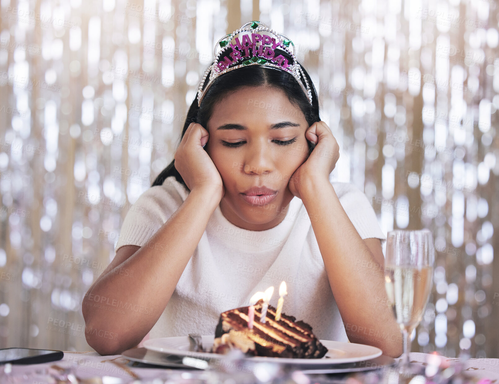 Buy stock photo Depression, birthday, and teenager bored at birthday celebration, isolated by covid and dull cake. Compliance, lockdown and sad female blow candles alone, feeling depressed and lonely during corona