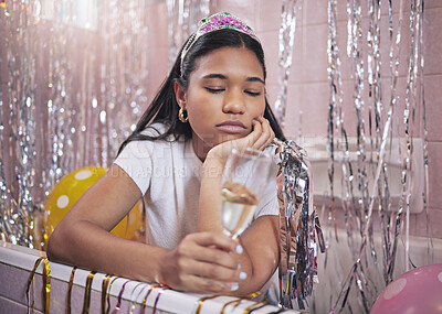 Buy stock photo Birthday girl, sad and champagne while feeling bored, upset and disappointed while sitting alone in bathtub lonely and depressed. Unhappy, boring and abandoned woman during quarantine celebration