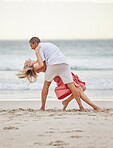 Dancing, happy couple and beach celebrate of love, trust and engagement on romantic luxury holiday travel Bali vacation. Man and woman or dancer couple celebration on sea water, sand and sunset ocean