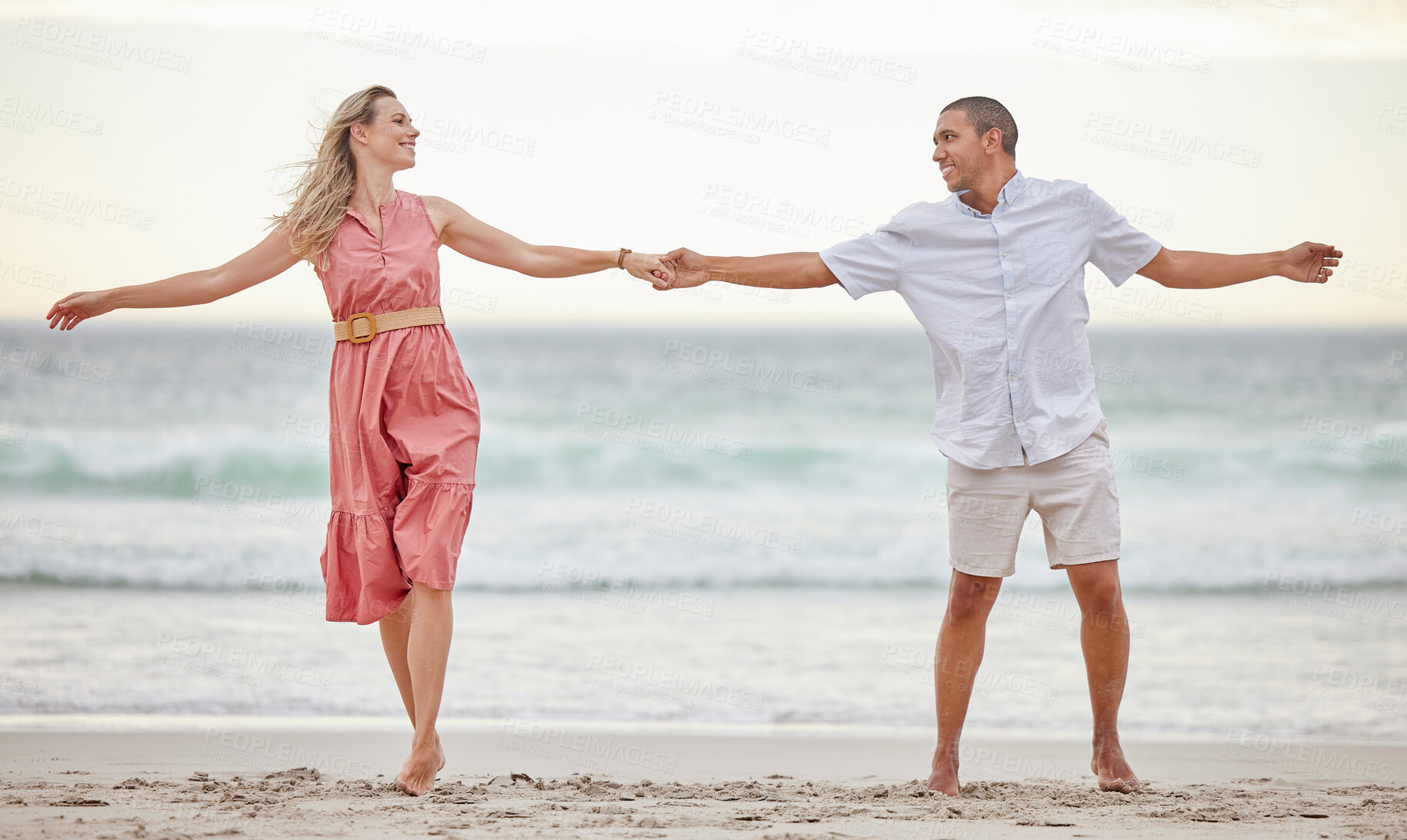 Buy stock photo Love, beach and couple happy, smile and romance, care and marriage relationship together. Summer, holiday and happiness with man and woman by the sea on travel vacation trip for freedom or honeymoon