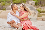 Love, hug and couple on the beach look into eyes and relax outdoor together on sand or ground. Happy interracial black man and woman enjoy summer holiday in nature for valentines day or anniversary
