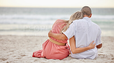 Buy stock photo Happy, love and couple on a beach hug watching the sunset, beach waves and sea together. Happy boyfriend and girlfriend embracing on the sand by ocean water in nature on a summer travel vacation