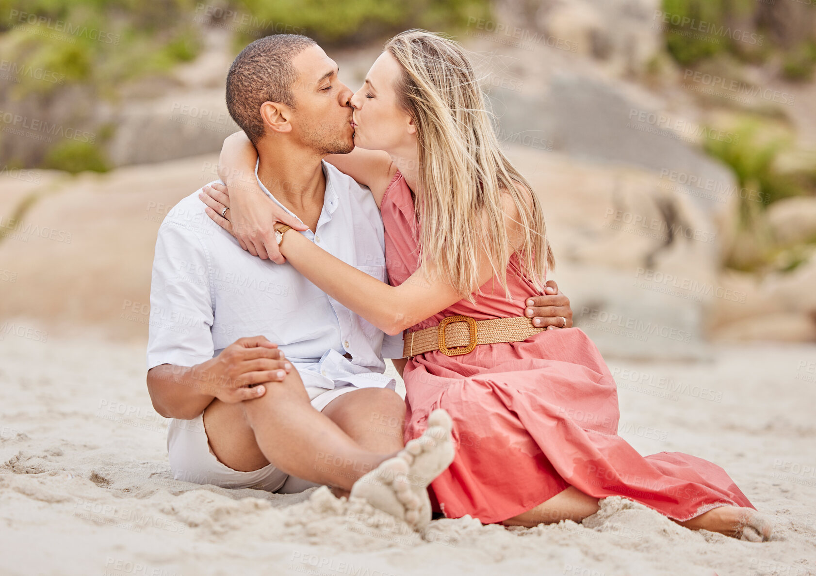 Buy stock photo Beach. love and a couple kiss on the sand on a summer weekend. Holiday, honeymoon and man and woman on a calm and romantic day at the sea. Nature, romance and happiness, relax together at the ocean.