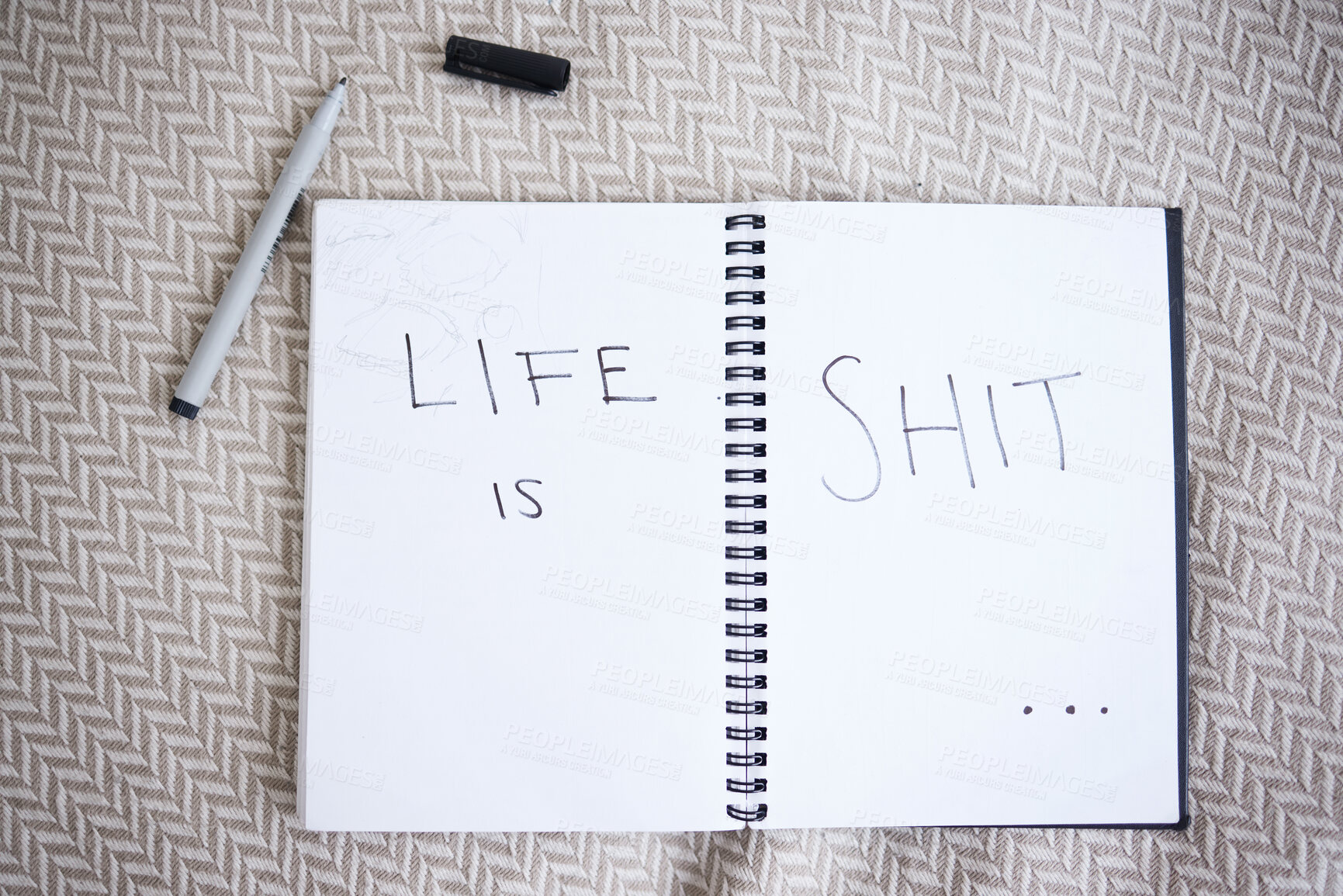 Buy stock photo Suicide, depression and a note with handwriting from suicidal thoughts. Mental health, sadness and a cry for help in notebook on a bed. Stress, anxiety and a sad message in writing that life is shit
