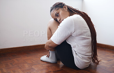 Buy stock photo Depression, stress and anxiety with a woman suffering with her mental health while sitting on the floor alone. Sad, fear and suicide with a young female thinking and feeling pain, angry or grief