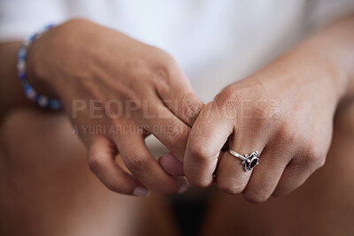 Buy stock photo Hands, anxiety and mental health with a woman inside feeling depression, stress or alone. Psychology, pain and crisis with a female holding her finger with her hand while sad, frustrated or depressed