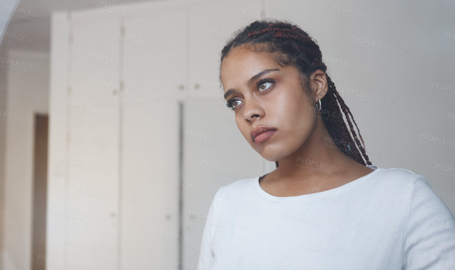 Buy stock photo Sad, thoughtful and depressed woman in her home feeling alone and isolated. Mock up for depression, sadness and mental health issues. Thinking, worried and upset young girl with problems in her room