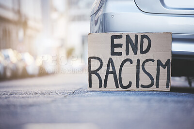 Buy stock photo End racism sign cardboard poster in urban street background for solidarity, human rights and race problem. Advertising of protest board for freedom, equality and stop violence with mockup lens flare