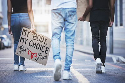 Buy stock photo Global, freedom and protest march for abortion rights with board sign and activism in a street in urban city. Pro choice, pro abortion and female empowerment posture with crowd fighting for change 
