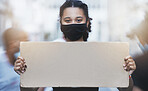 Activism, protest and girl with cardboard poster with copy space in street with face mask during pandemic. Portrait of human rights activist protesting with empty sign for equality or justice in city