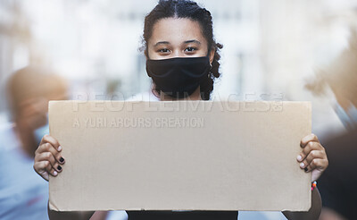 Buy stock photo Activism, protest and girl with a poster with copy space in a street with face mask during pandemic. Portrait of human rights activist protesting with a empty sign for equality or justice in the city
