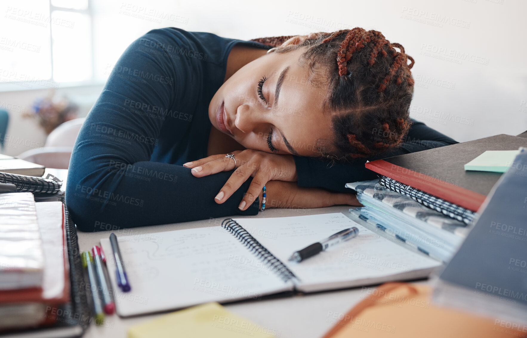 Buy stock photo Burnout, sleeping student at desk with books while studying, reading or university education knowledge in room. Tired fatigue gen z black woman in home office with notebook for scholarship learning