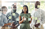 Sticky notes, meeting and teamwork with diversity in the workplace. Ideas, thinking and working team brainstorming in the office with notes on glass wall. Multicultural, business and corporate group