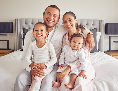 Buy stock photo Happy family portrait in bedroom with parents, baby and children smile, love and happiness. Mother, father and girl kid excited while on dad and mom lap for youth, wellness and childhood development