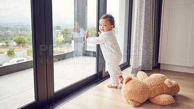 Buy stock photo A baby by window, learning and walking for child development. Baby girl, toddler and young kid standing with support to learn and develop walking skills. Help, first steps and teaching in childcare