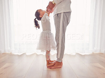 Buy stock photo Family, dance and daughter on dad feet together on floor of interior for happiness, childhood and bonding. Care, love and youth with father dancing with child, walking on foot step for support