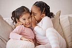 Children, secret and girls whispering in ear with love, trust and happiness while playing on a sofa at home. Interracial, adoption and bond between girl siblings, sister friends and kids having fun
