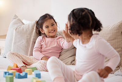 Buy stock photo Children friends with high five for learning or celebration with building blocks together on the bed and happy smile. Baby girls or kid playing with motivation, support and fun child development game